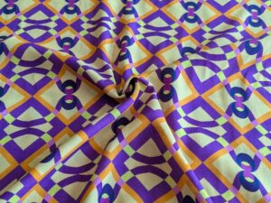 Viskosestoff - Retro Musterung Lila / Orange / Gelb